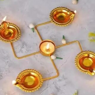 Golden Swastik Rangoli Stand: Elegant Metal Decoration